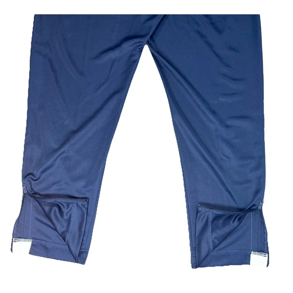 ⁠Nike Sportswear Men's Large Blue Straight Leg Ankle Zip Casual Outdoor Pants⁠